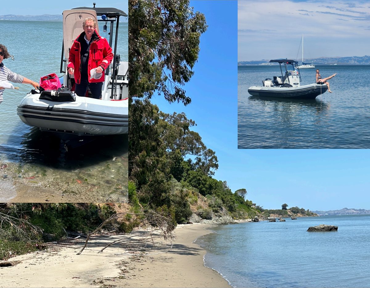 Captain Frantz aboard, the boat anchored off a secluded cove
